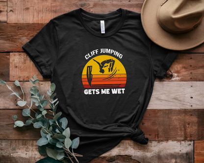 "Cliff Jumping Gets Me Wet" Shirt | Funny Cliff Jumping T-Shirt for Outdoorsy Adventurers - Retro Vintage Sunset Design