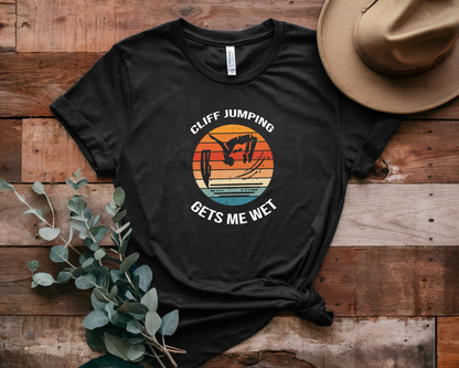 "Cliff Jumping Gets Me Wet" Shirt | Funny Cliff Jumping T-Shirt for Outdoorsy Adventurers - Retro Vintage Sunset Design